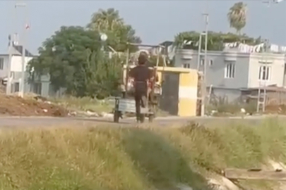 Adana'da oğlunu elektrikli bisikletin arkasında koşturan kişi yakalandı